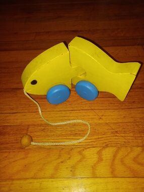 Yellow Wooden Pull-Along Fish Toy with Blue Wheels